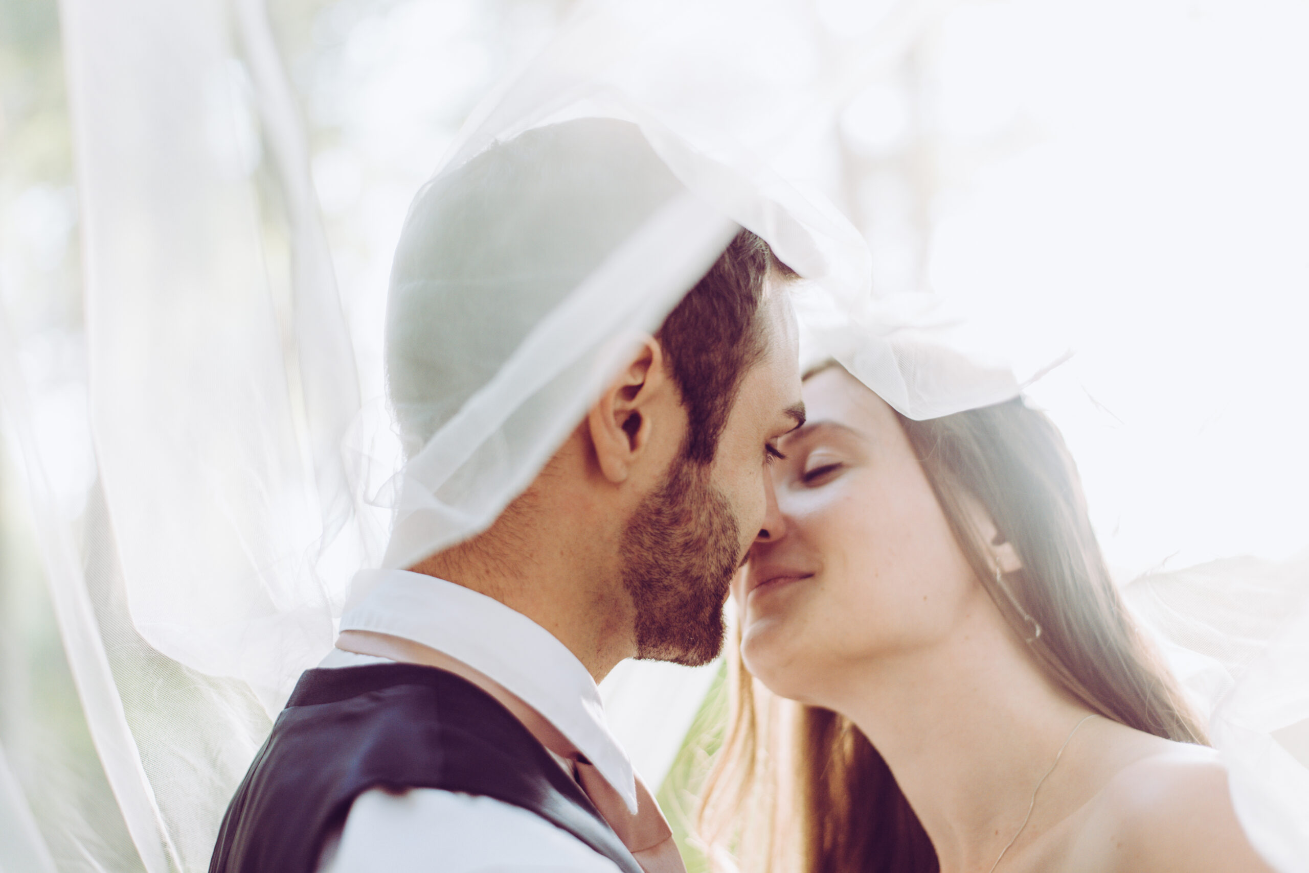 Harry and Laura romantic wedding veil portrait